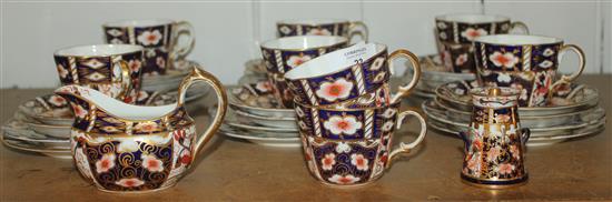 Royal Crown Derby Imari coffee set and a miniature milk churn